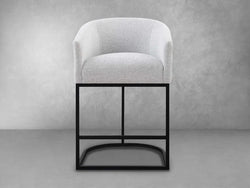 A black metal bar stool featuring a comfortable grey upholstered seat, ideal for modern interiors