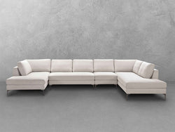 A contemporary white sectional sofa featuring a sleek wooden base, showcasing a blend of comfort and modern design