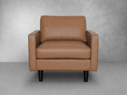 A tan leather chair featuring sleek black legs, showcasing a modern and stylish design suitable for any interior