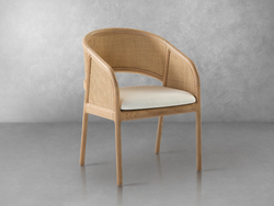 A wooden chair featuring a white cushion, showcasing a simple and elegant design suitable for various settings