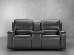 A black leather reclining loveseat is displayed, showcasing its sleek design and comfortable seating