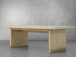 A wooden dining table featuring an elegant gold base, showcasing a blend of natural and luxurious materials.